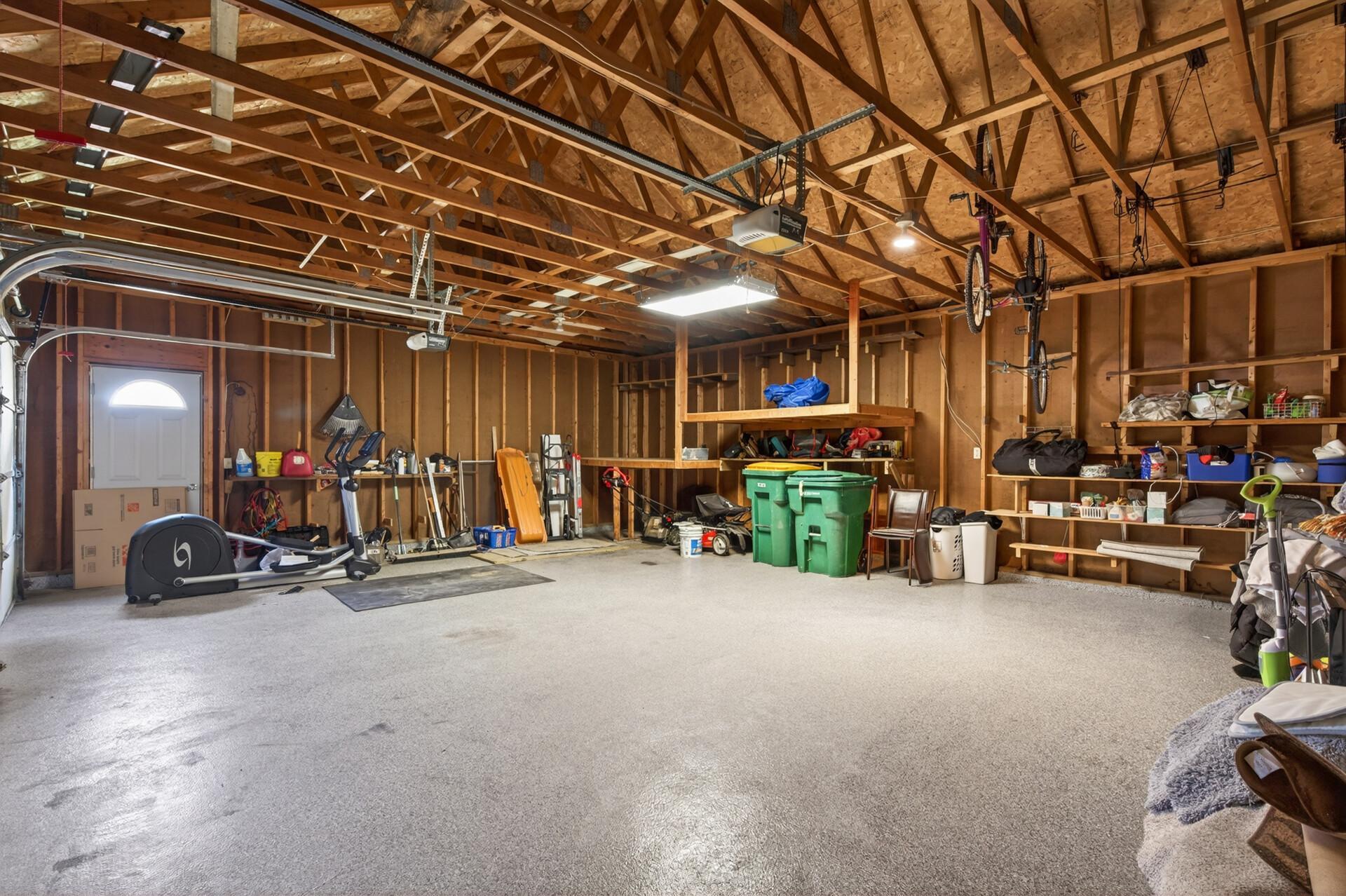 Attached 3-gar garage has epoxy flooring and a service door to the side yard.