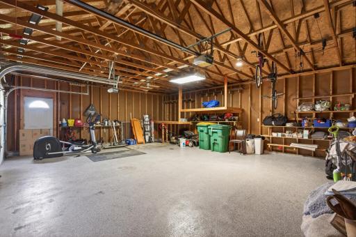 Attached 3-gar garage has epoxy flooring and a service door to the side yard.