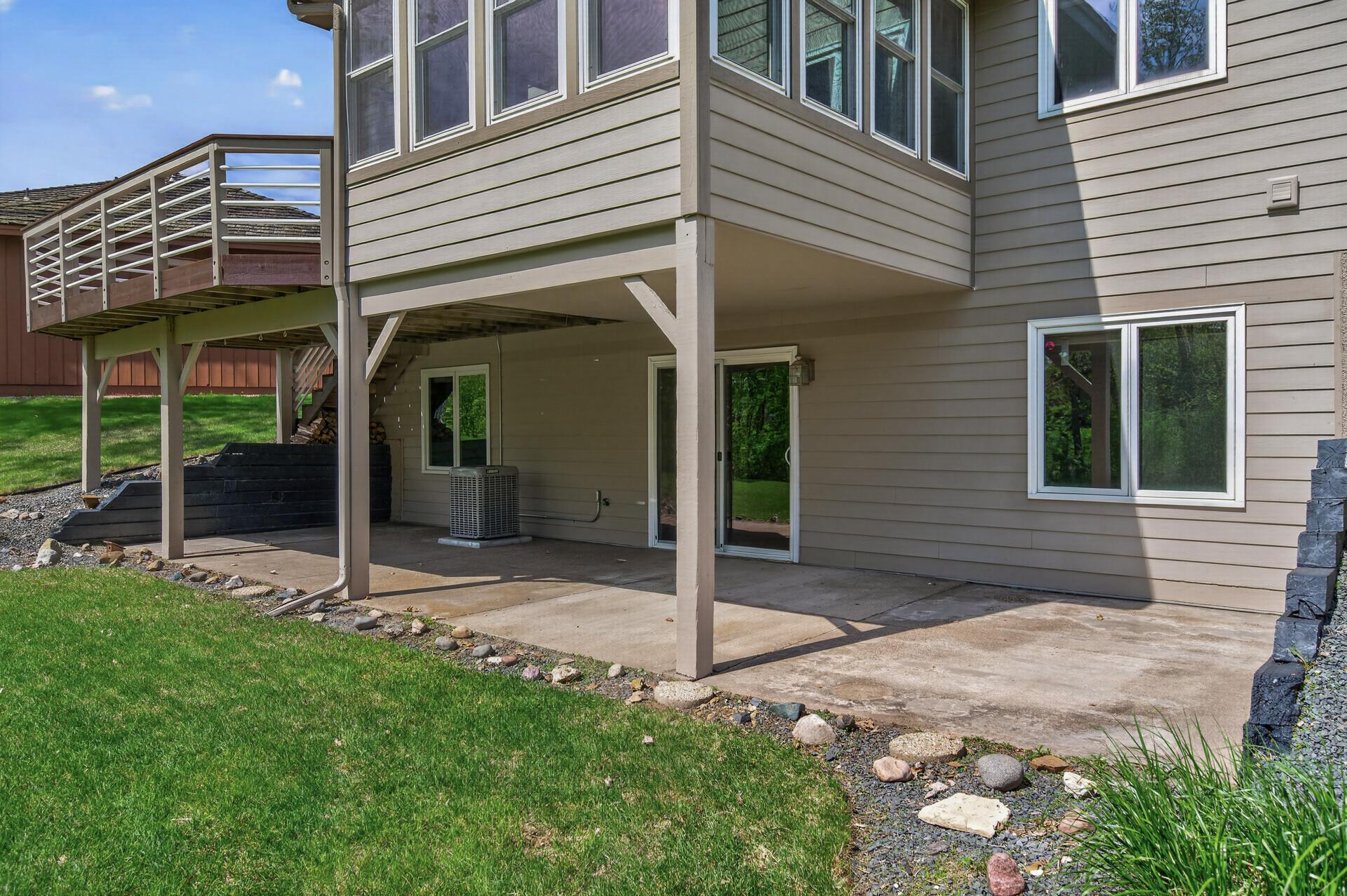 Concrete patio just outside of the walkout basement sliding door.
