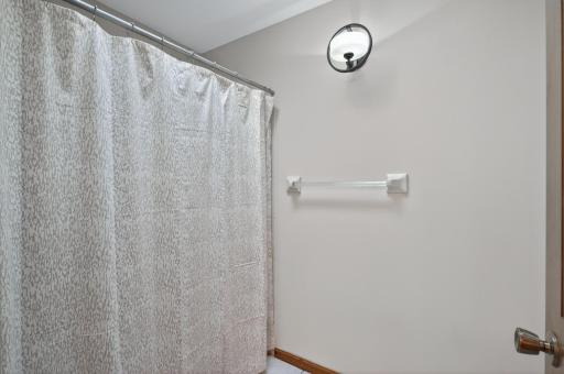 Full bathroom in upper level hallway has another room with the toilet and bath/shower.