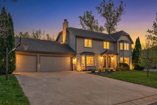 Beautifully maintained home with large concrete driveway and 3-stall garage.