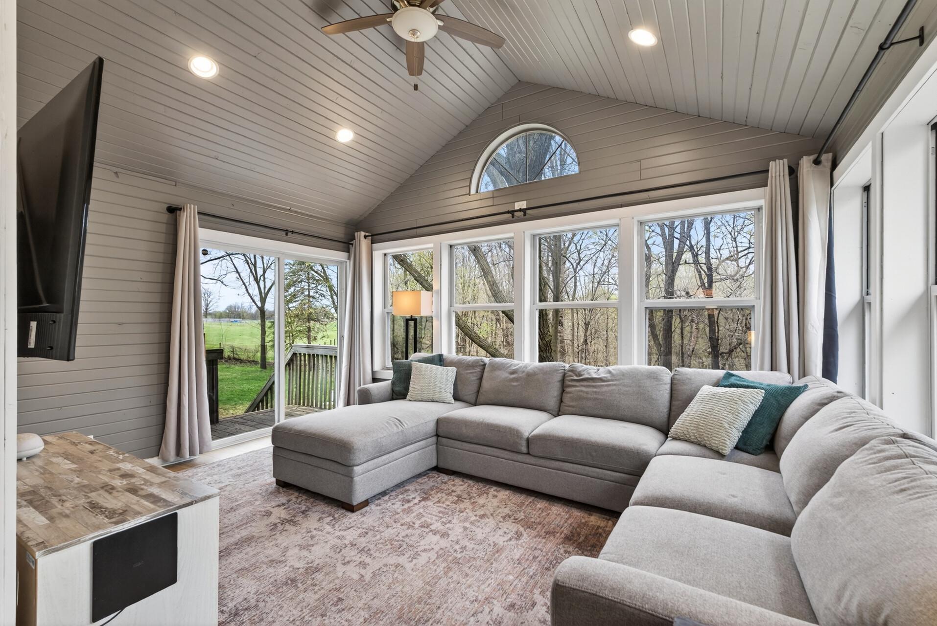 Relax and take in the scenery in this spacious sunroom.