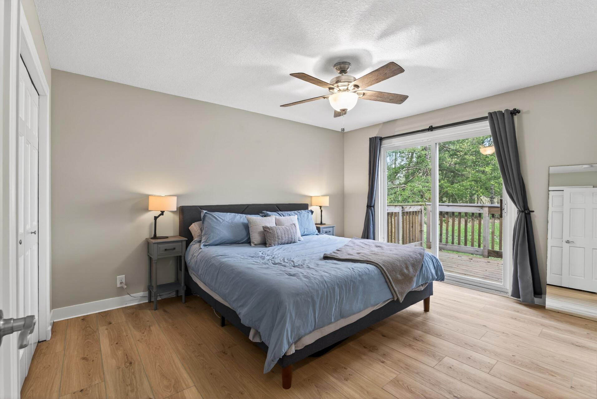 Primary Bedroom with dual closets and private balcony.