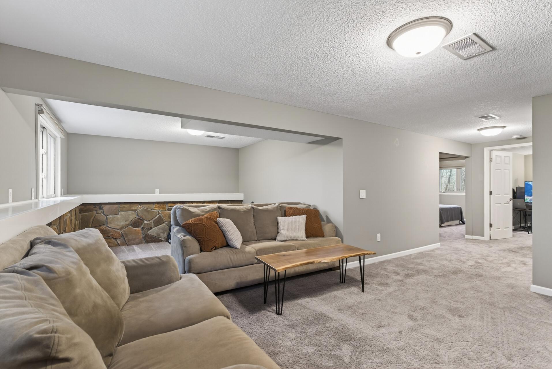 Plenty of space behind the living room for wet bar or exercise area.