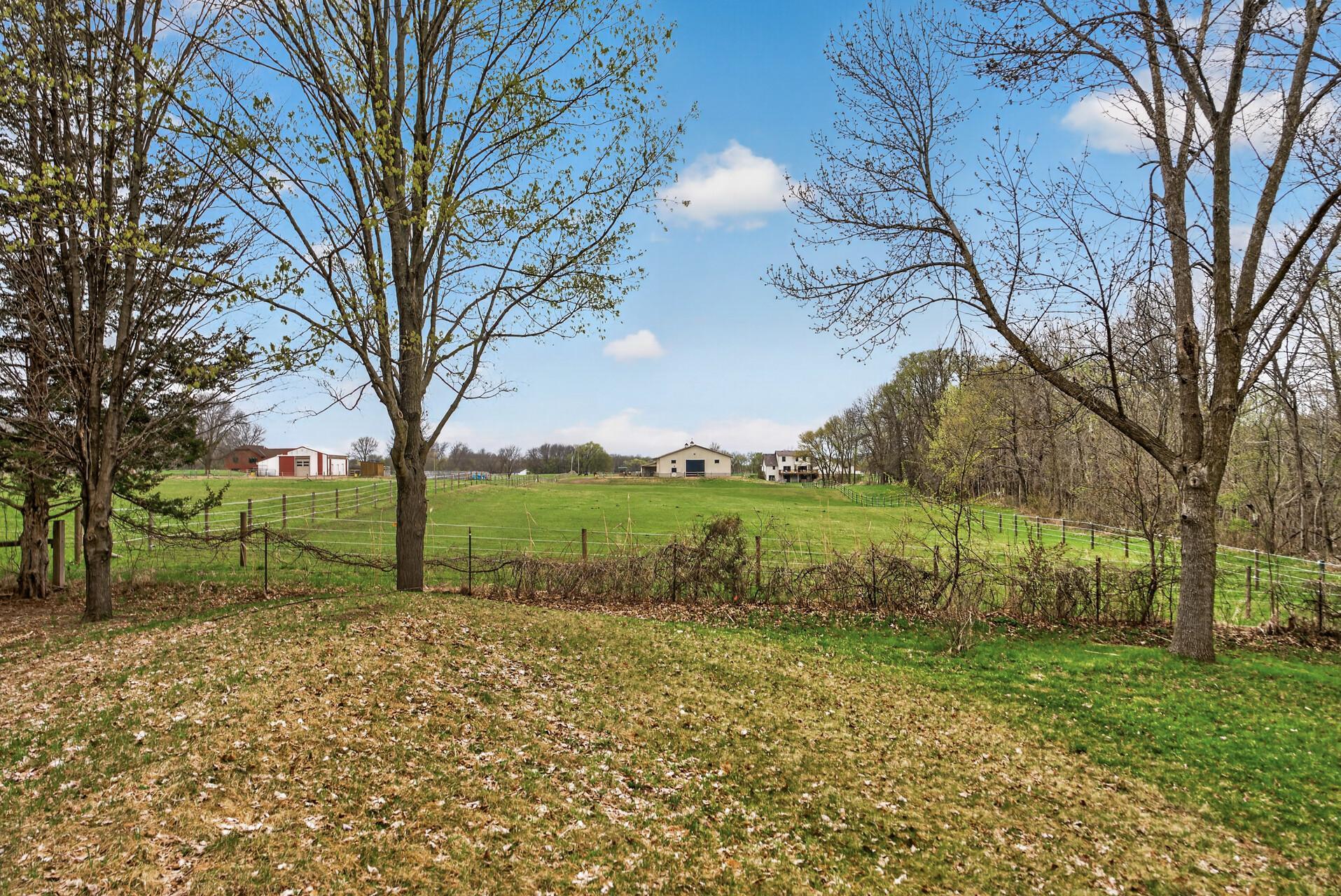 Neighboring property to the west has large horses pasture.