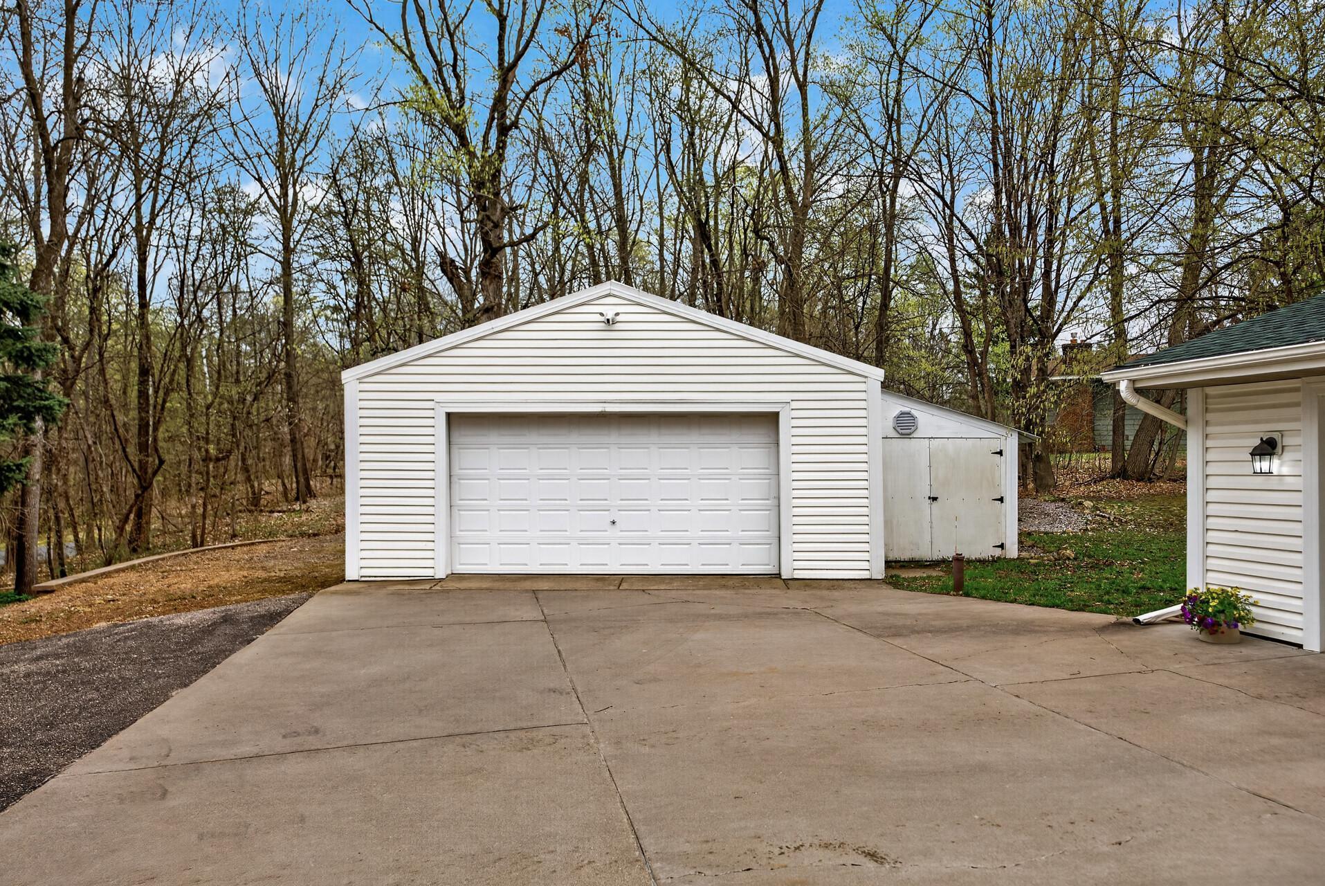 40x25 Pole Shed ready for your toys/workshop. Additional storage shed to the right.