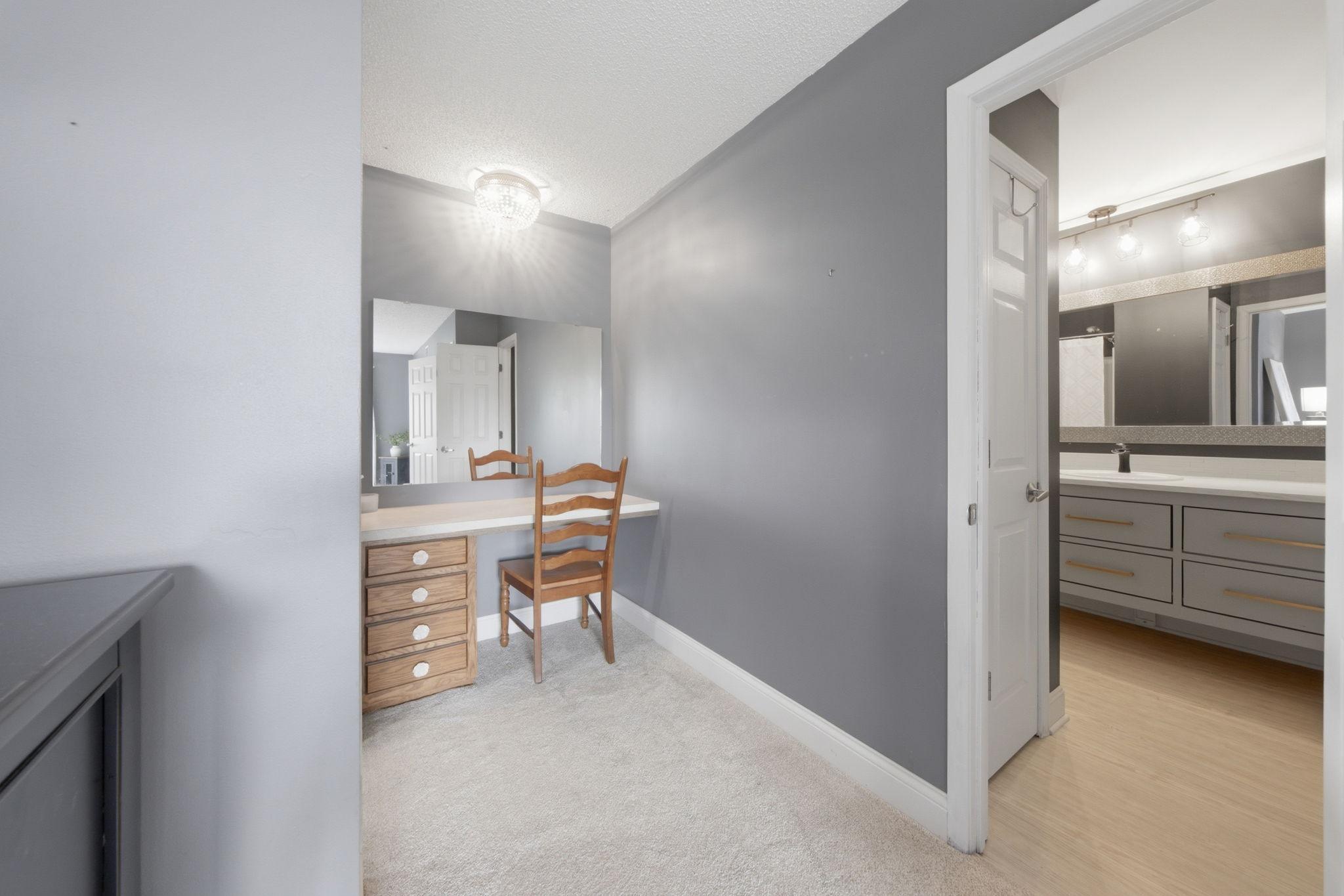 Vanity in primary with walk through to main bathroom