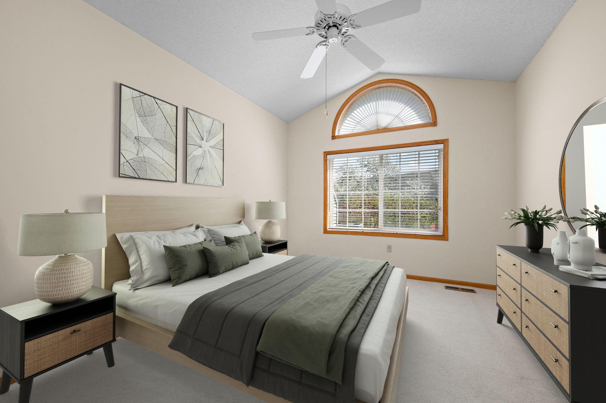 Primary Suite: A spacious retreat with vaulted ceilings, a walk-in closet, and a private full bath equipped with a jetted tub, separate shower, and natural solar tube lighting