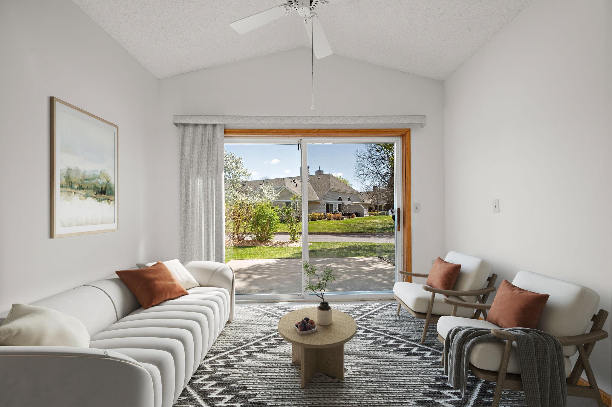 Relax in the vaulted sunroom featuring elegant French doors and direct access to your private patio