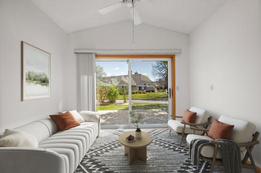 Relax in the vaulted sunroom featuring elegant French doors and direct access to your private patio