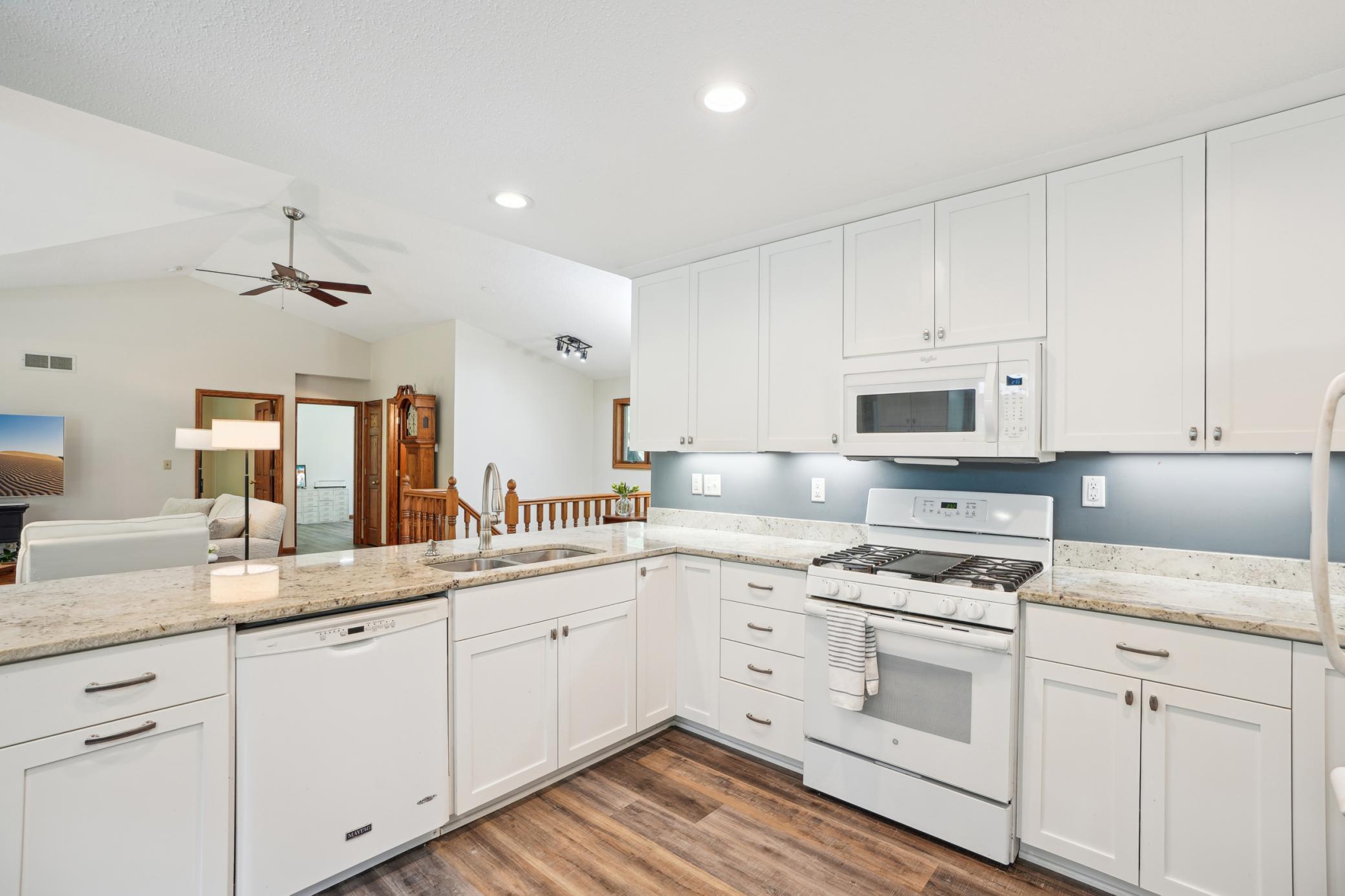Designed for connection and convenience, this kitchen flows seamlessly into the living area.jpg