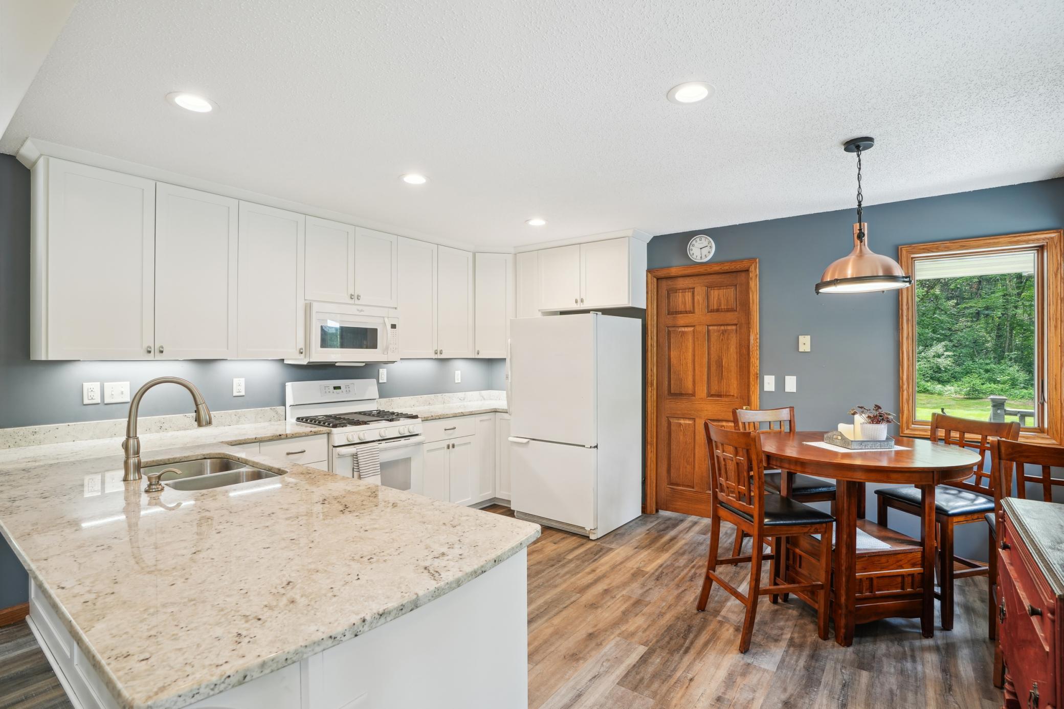 Sun-filled kitchen and dining space designed for both function and comfort.jpg