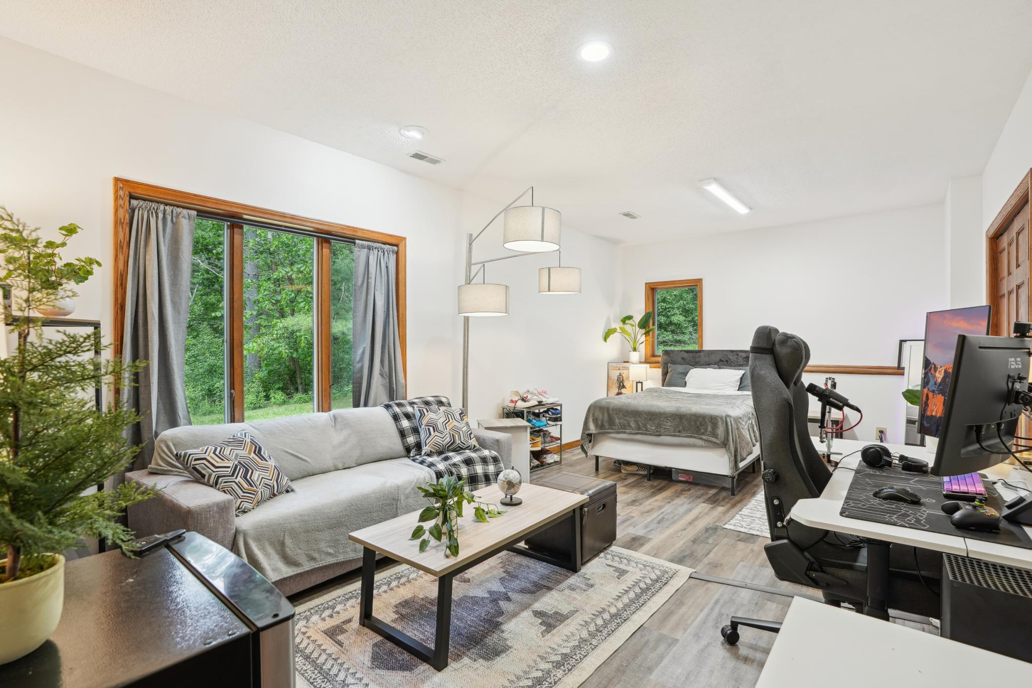 Spacious lower-level bedroom suite offering privacy and flexibility, ideal for guests, extended family, or multi-generational living.jpg