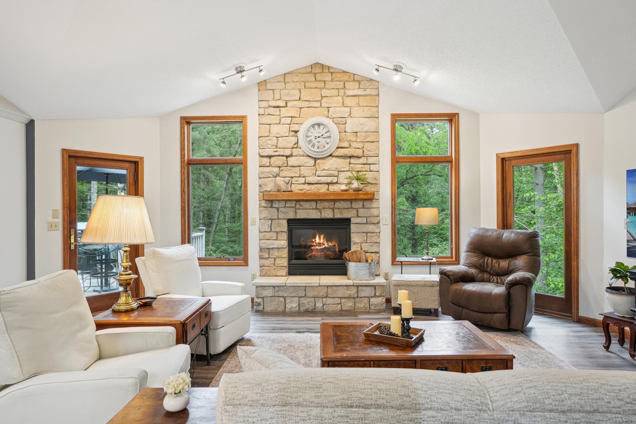 Inviting living area featuring a beautiful fireplace focal point.jpg