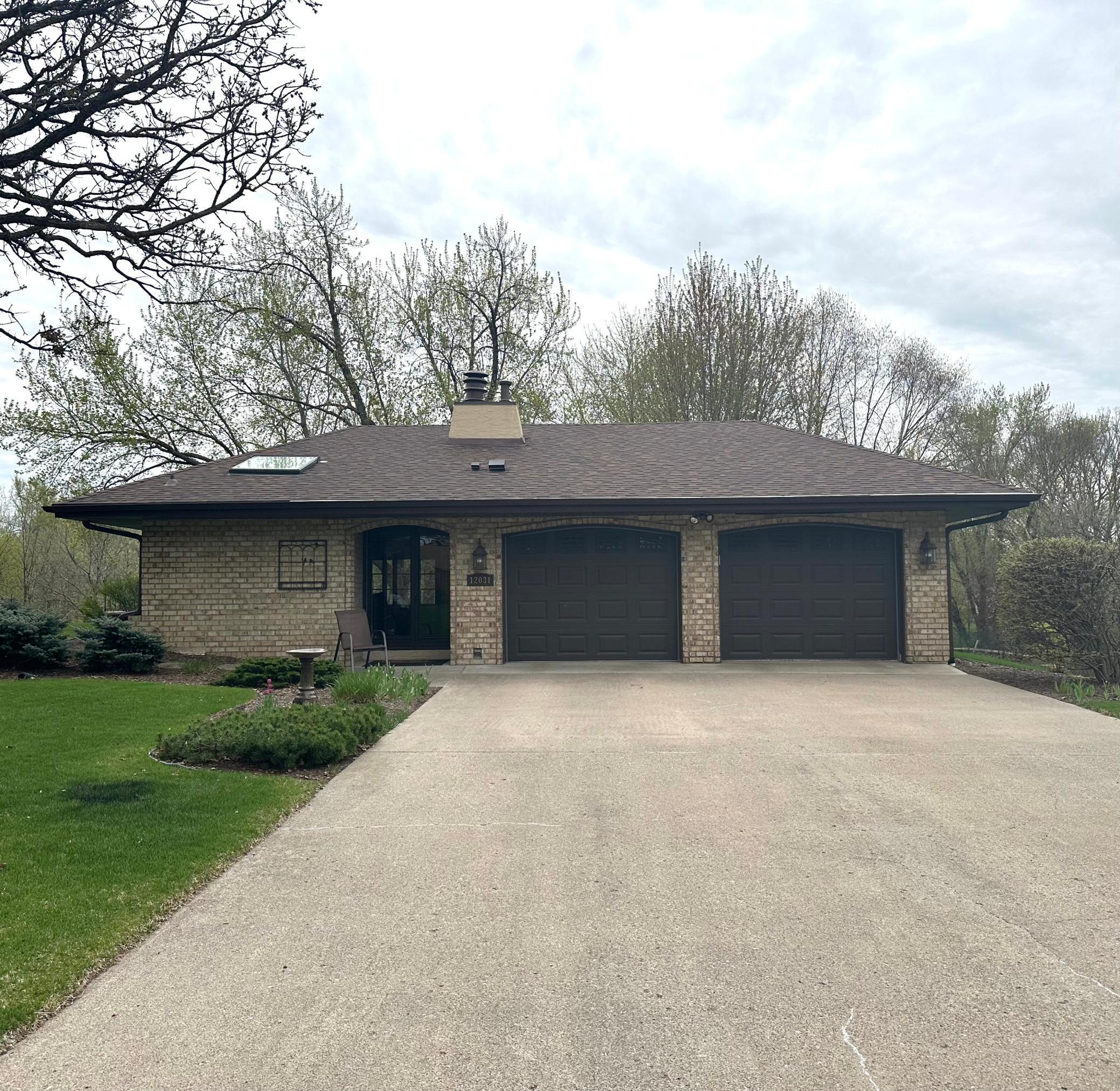 Beautiful brick home with concrete driveway and a 4 car garage!