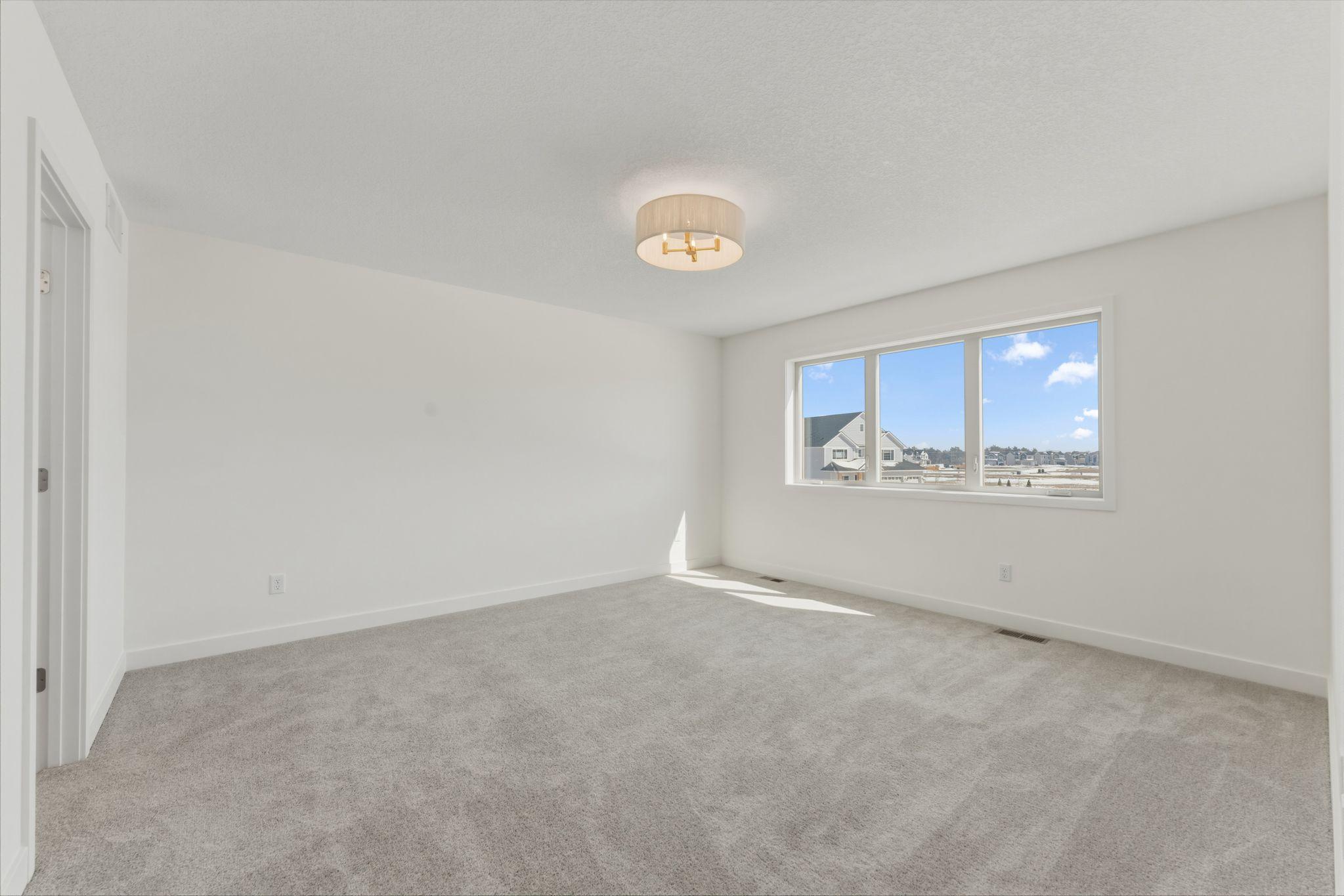 Owner's bedroom with large windows