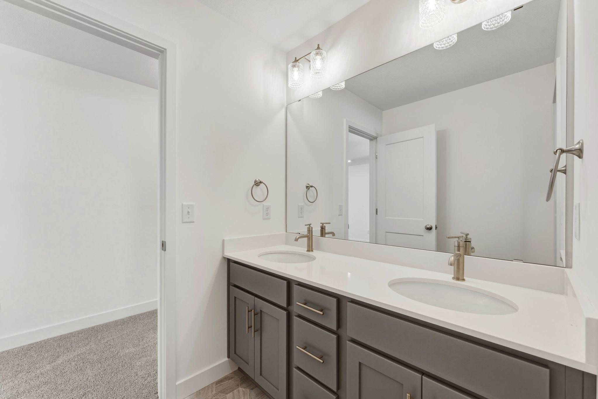 Vanities in upper level hall bath