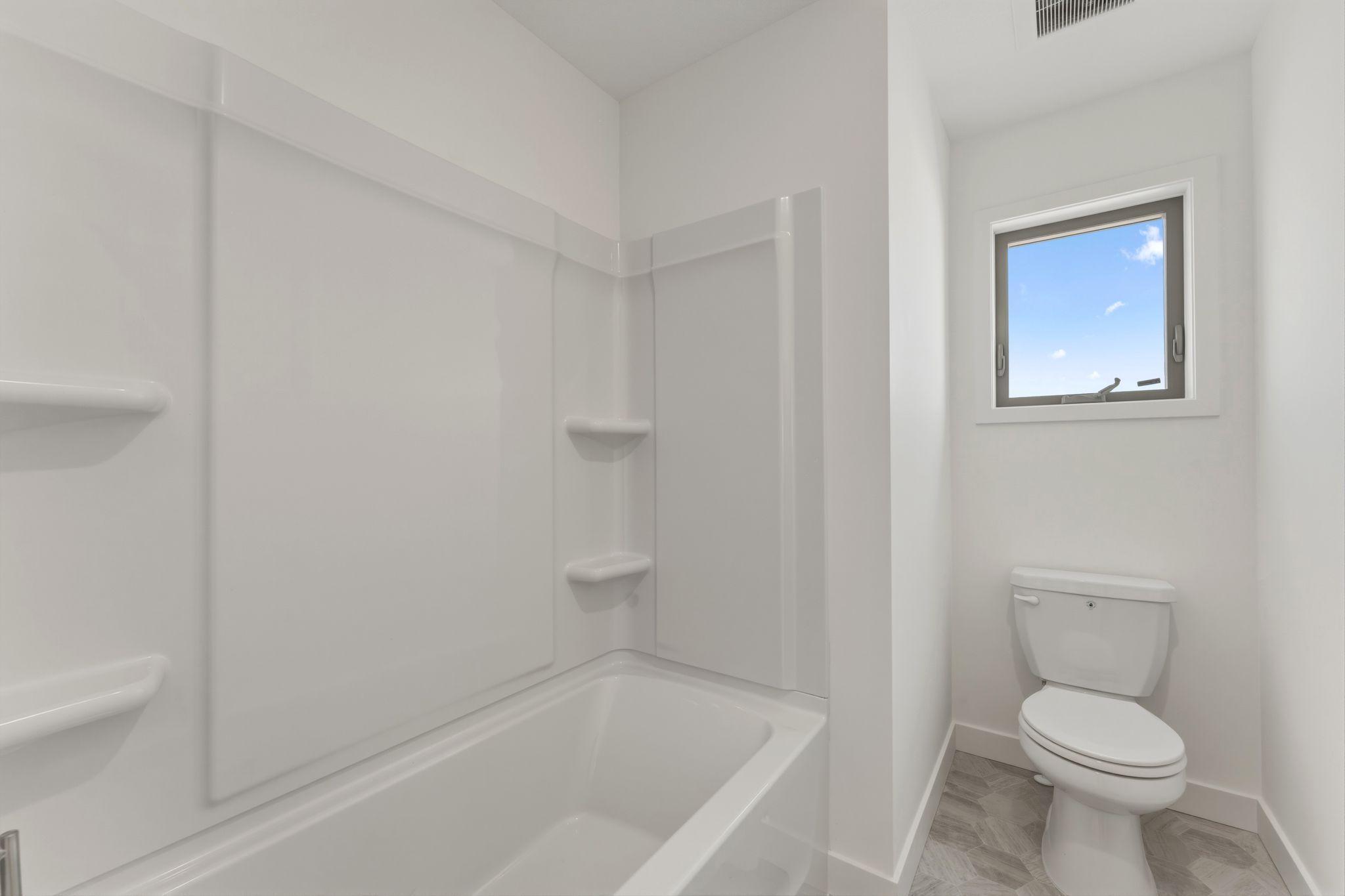 tub/shower in upper level hall bath
