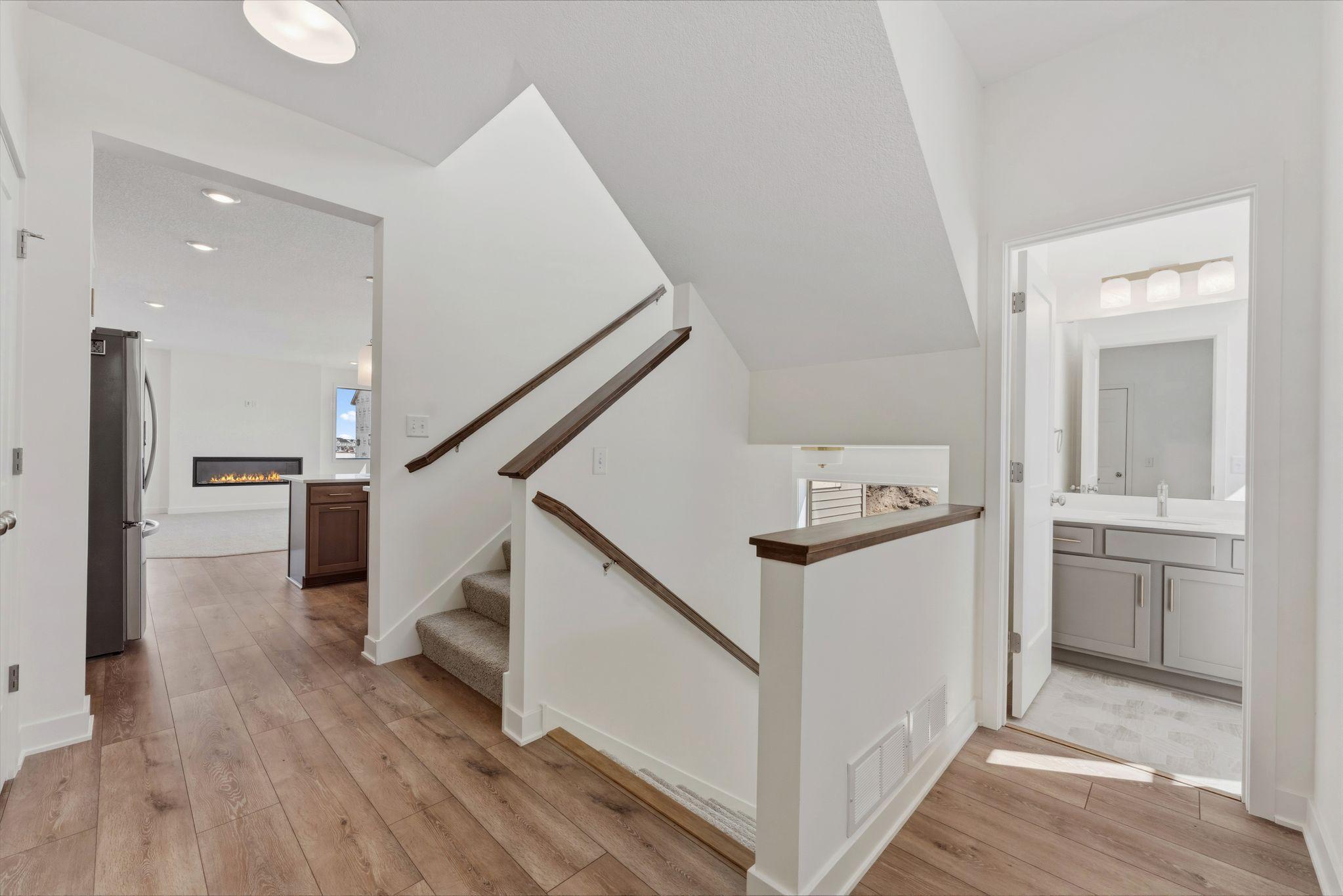 Stairs in the back of the home off the mudroom
