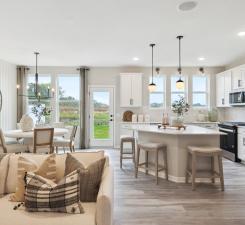 The Duncan offers a convenient dining room location right off the kitchen, perfect for any sized table! Photo of model home.