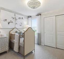 Spacious guest bedrooms are perfect for any use! Photo of model home.