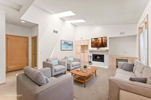 Vaulted main floor family room with built-ins and gas fireplace