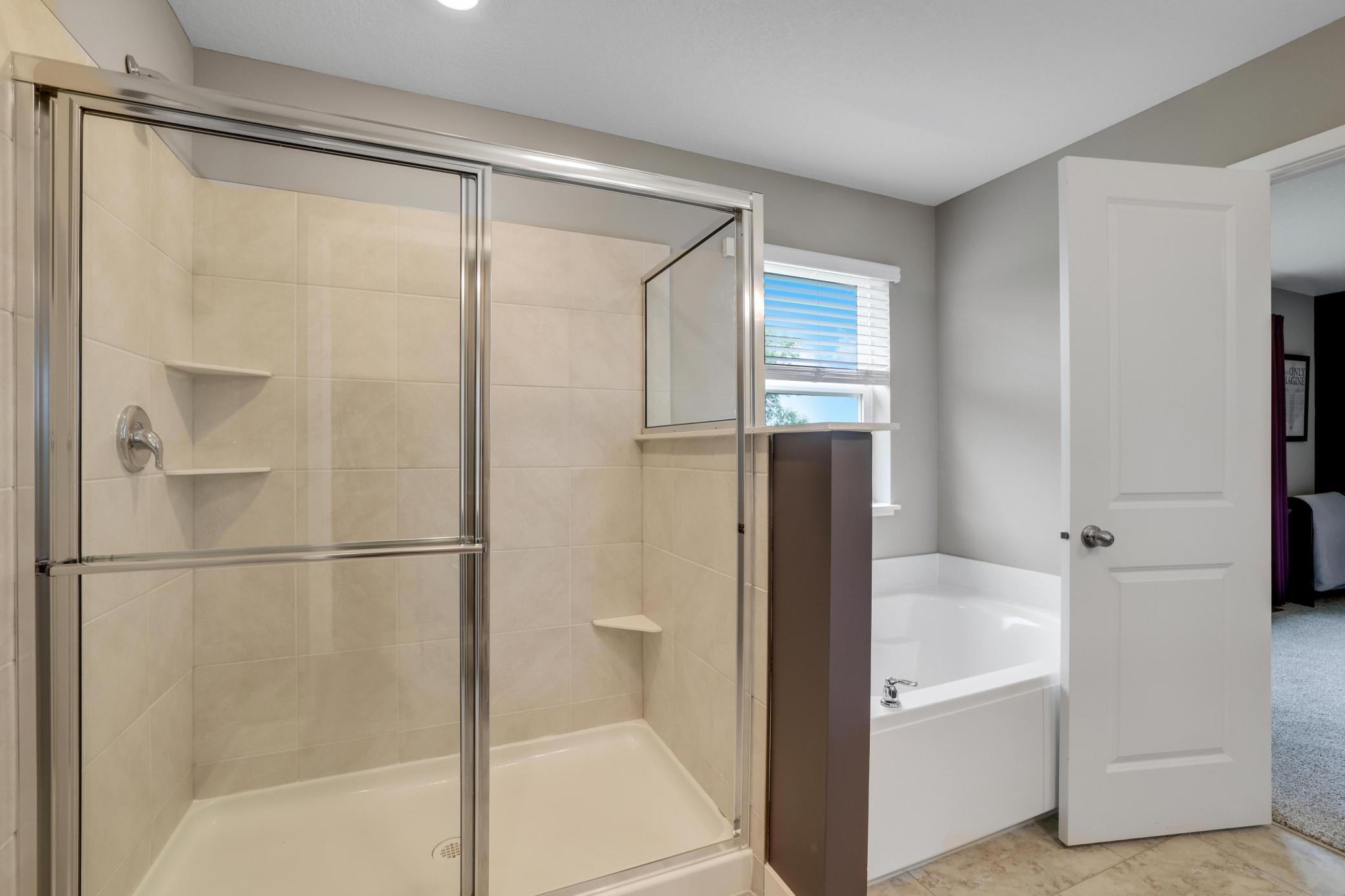 Primary Bathroom sep tub & shower.jpg