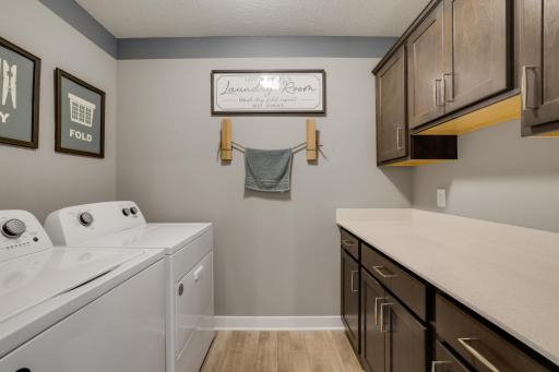 Upper level Laundryroom with loads of cabinetry!