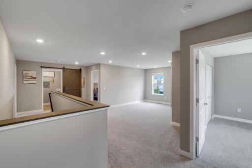 Large upper level Loft area is perfect for private family time together.