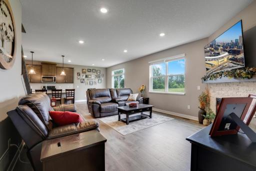 Livingroom with cozy fireplace is conveniently open to diningroom and kitcken.