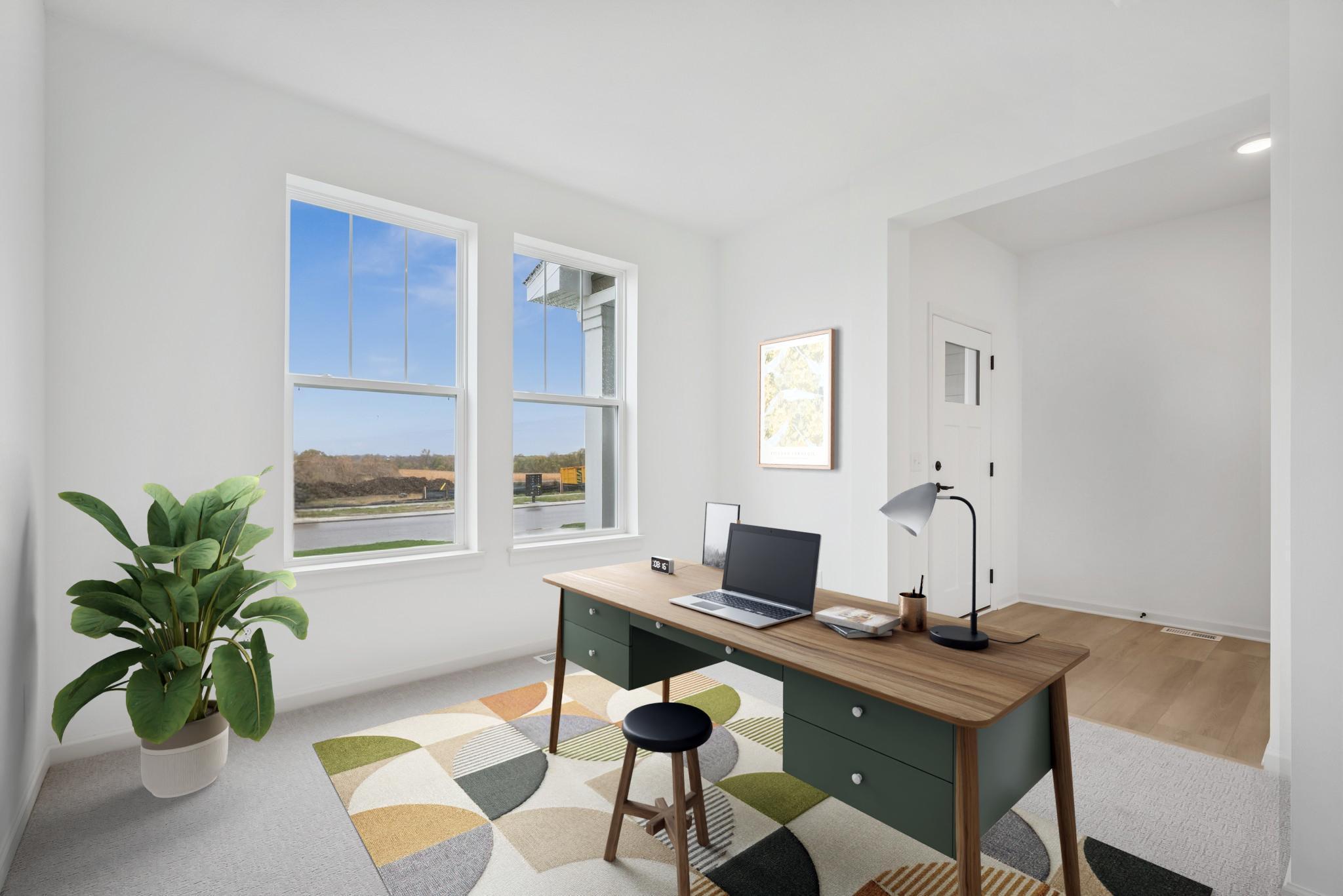 Main floor office space (Virtually staged) *Photos of a similar home*