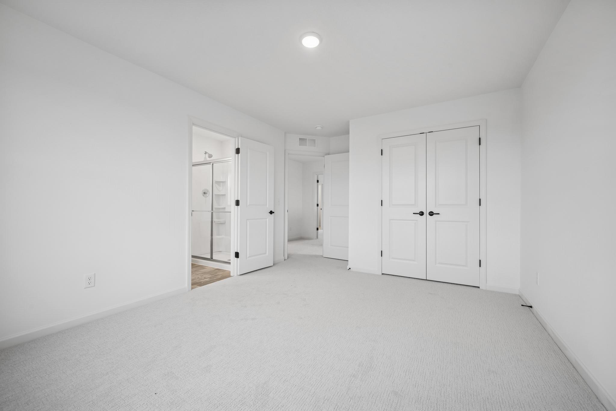 Secondary bedroom w ensuite bath *Photos of a similar home*