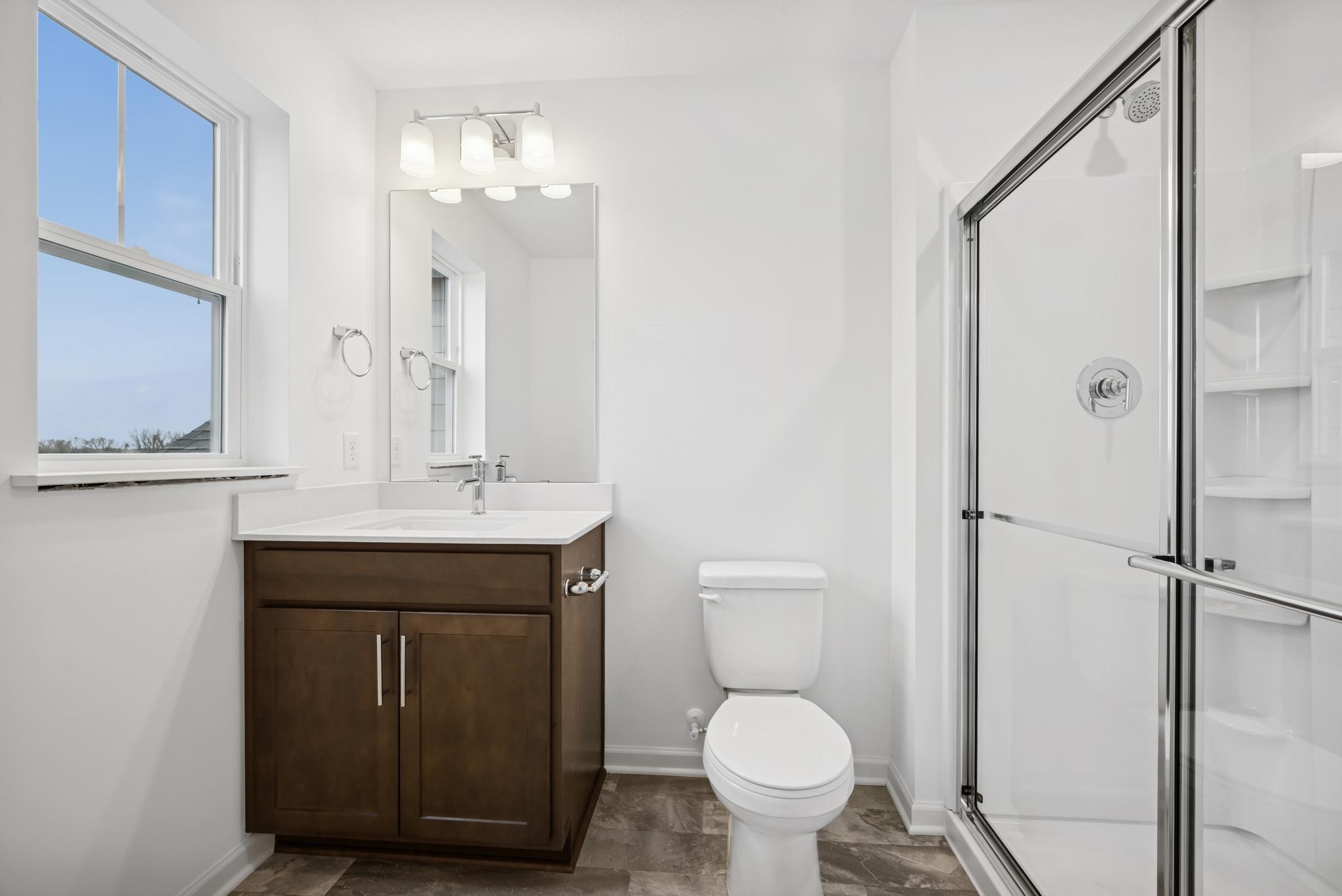 Ensuite bath in secondary bedroom *Photos of a similar home*