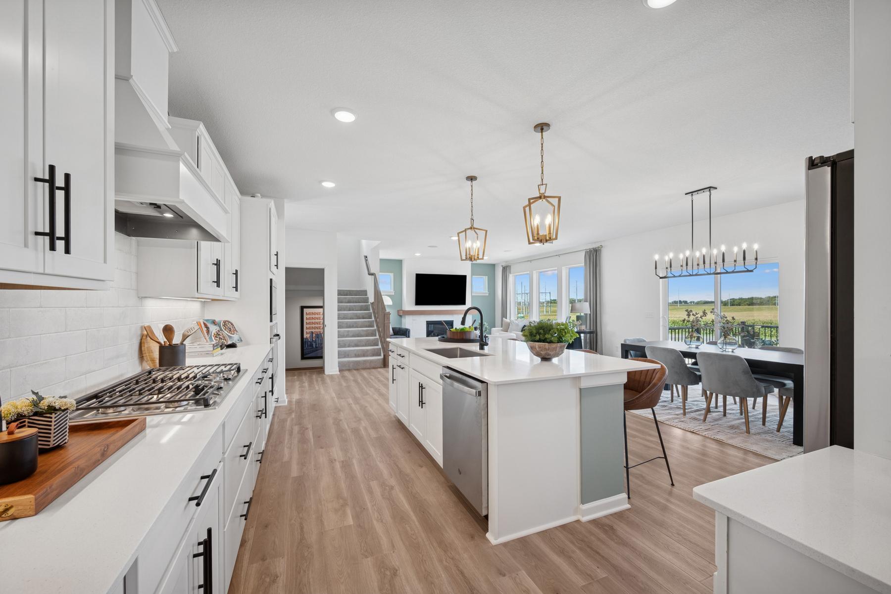 Kitchen and dining/living. Photo of Model Home - Same plan