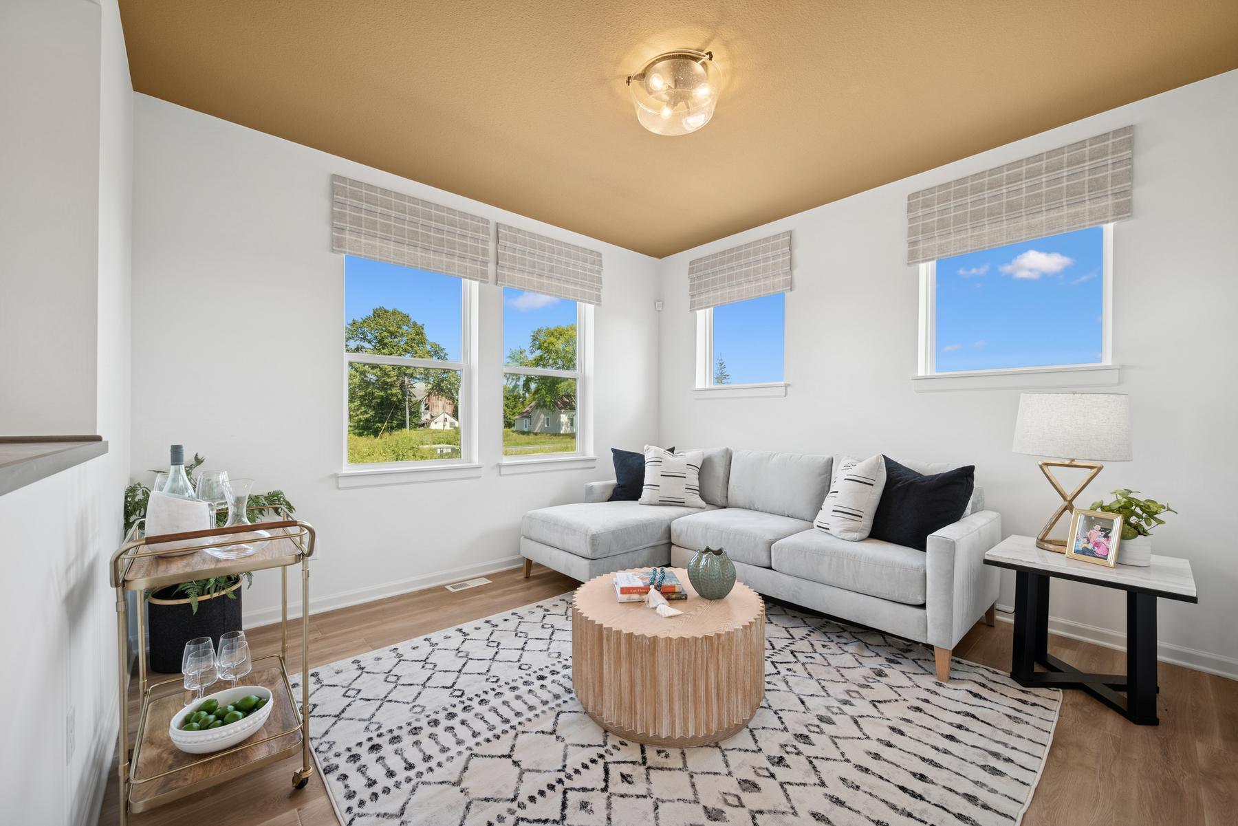 Sitting room on main. Photo of Model Home - Same Plan