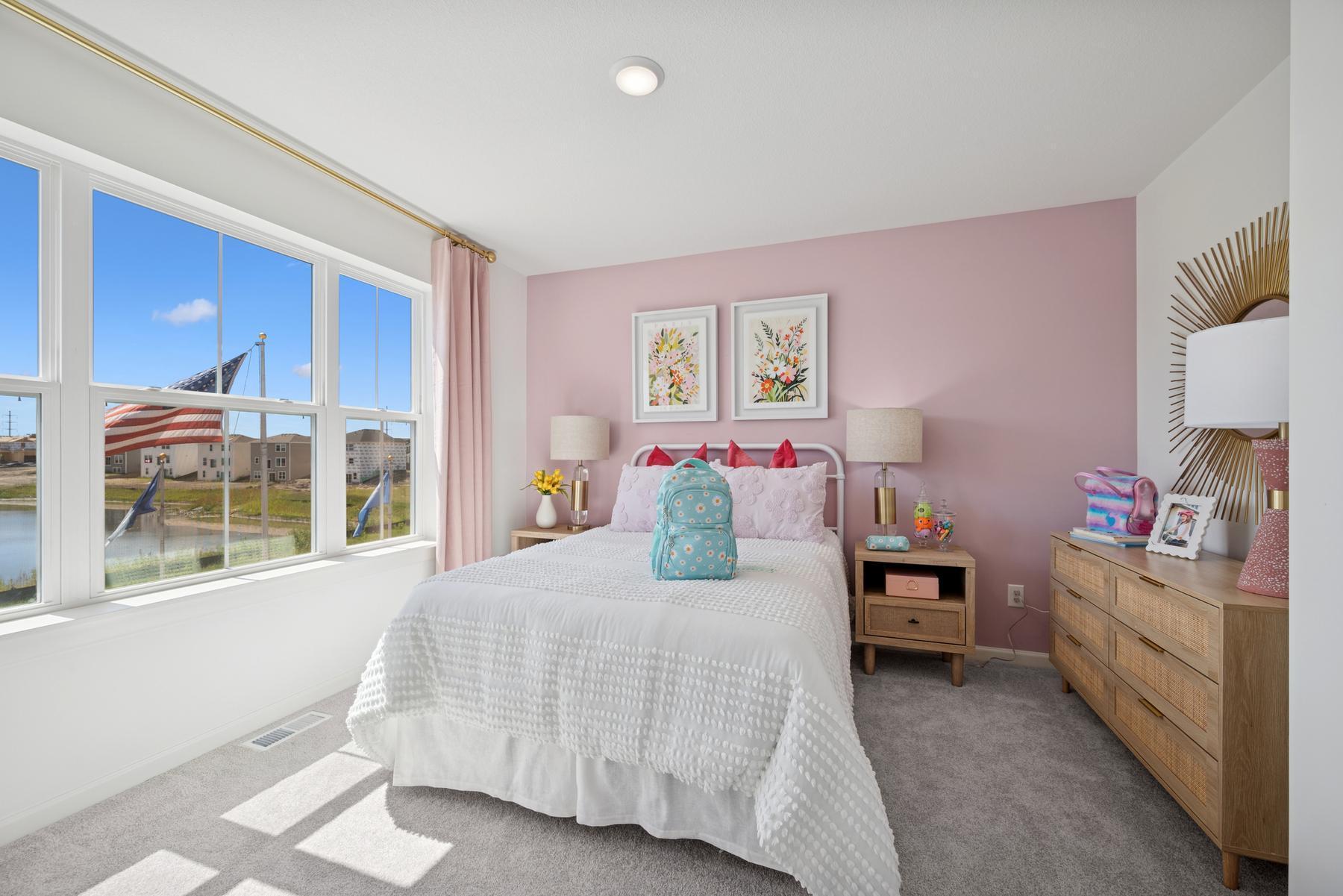 Secondary Bedroom Upstairs. Photo of Model Home - Same Plan