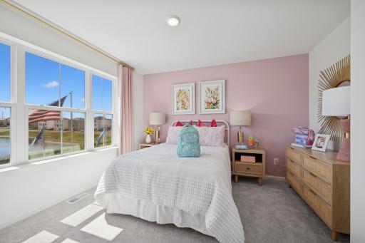 Secondary Bedroom Upstairs. Photo of Model Home - Same Plan
