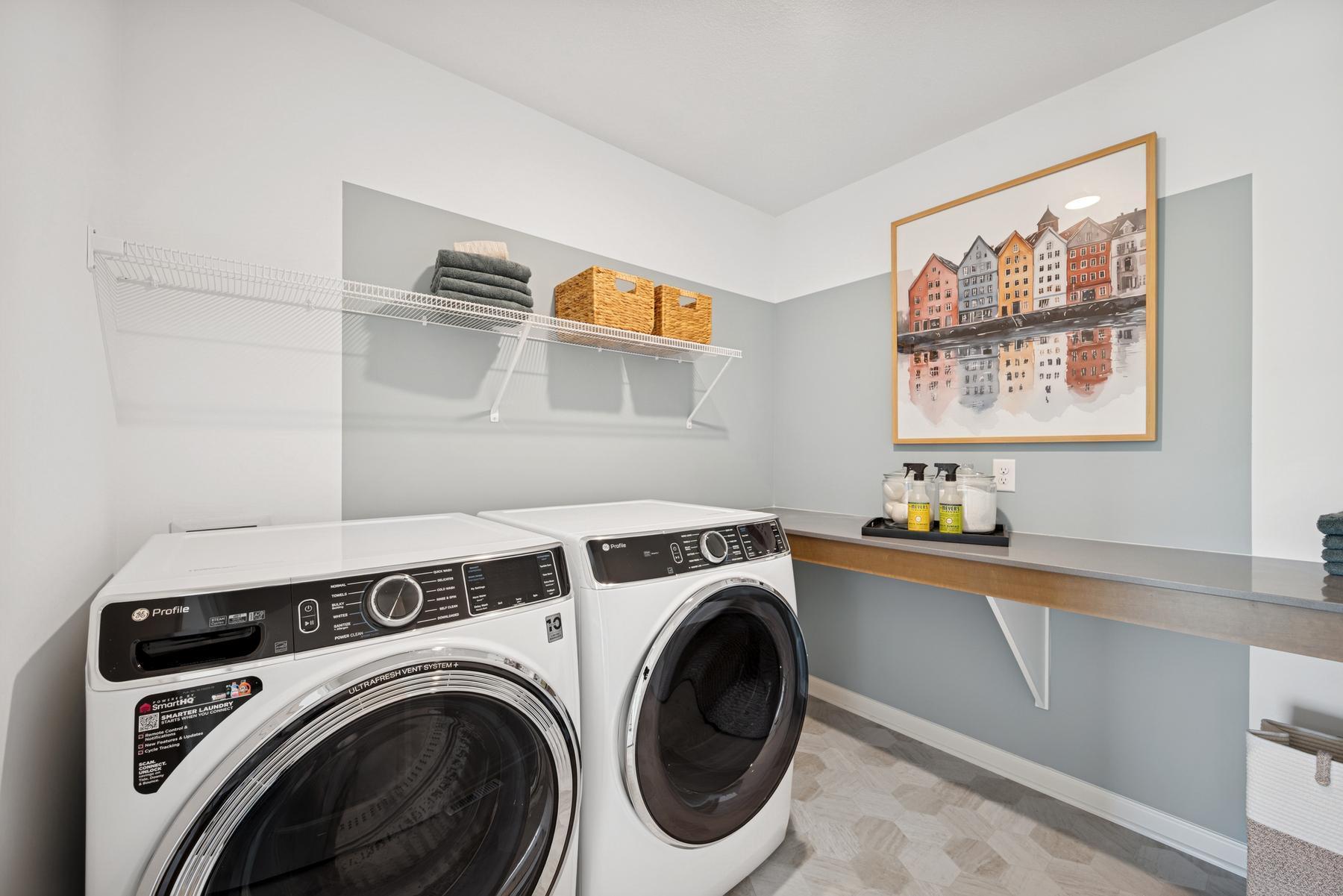 Utility Room Upstairs. Photo of Model Home - Same Plan