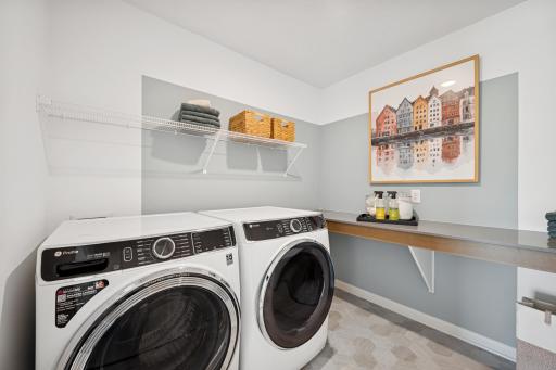 Utility Room Upstairs. Photo of Model Home - Same Plan