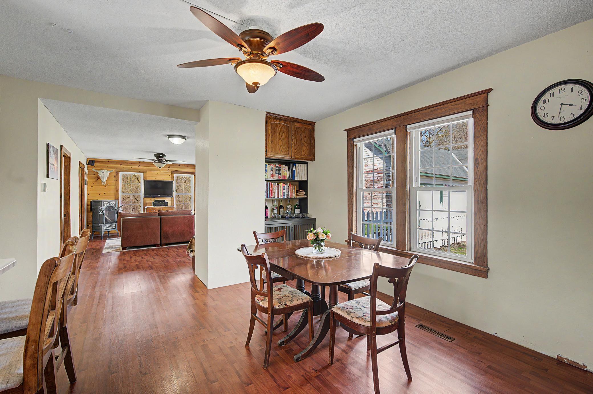 A view from the causal dining area over looking one of 2 living rooms on the main