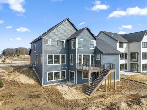 Exterior walk-out. Deck not included. Landscaping is included. This is not the actual home, but a model of the same floorplan.
