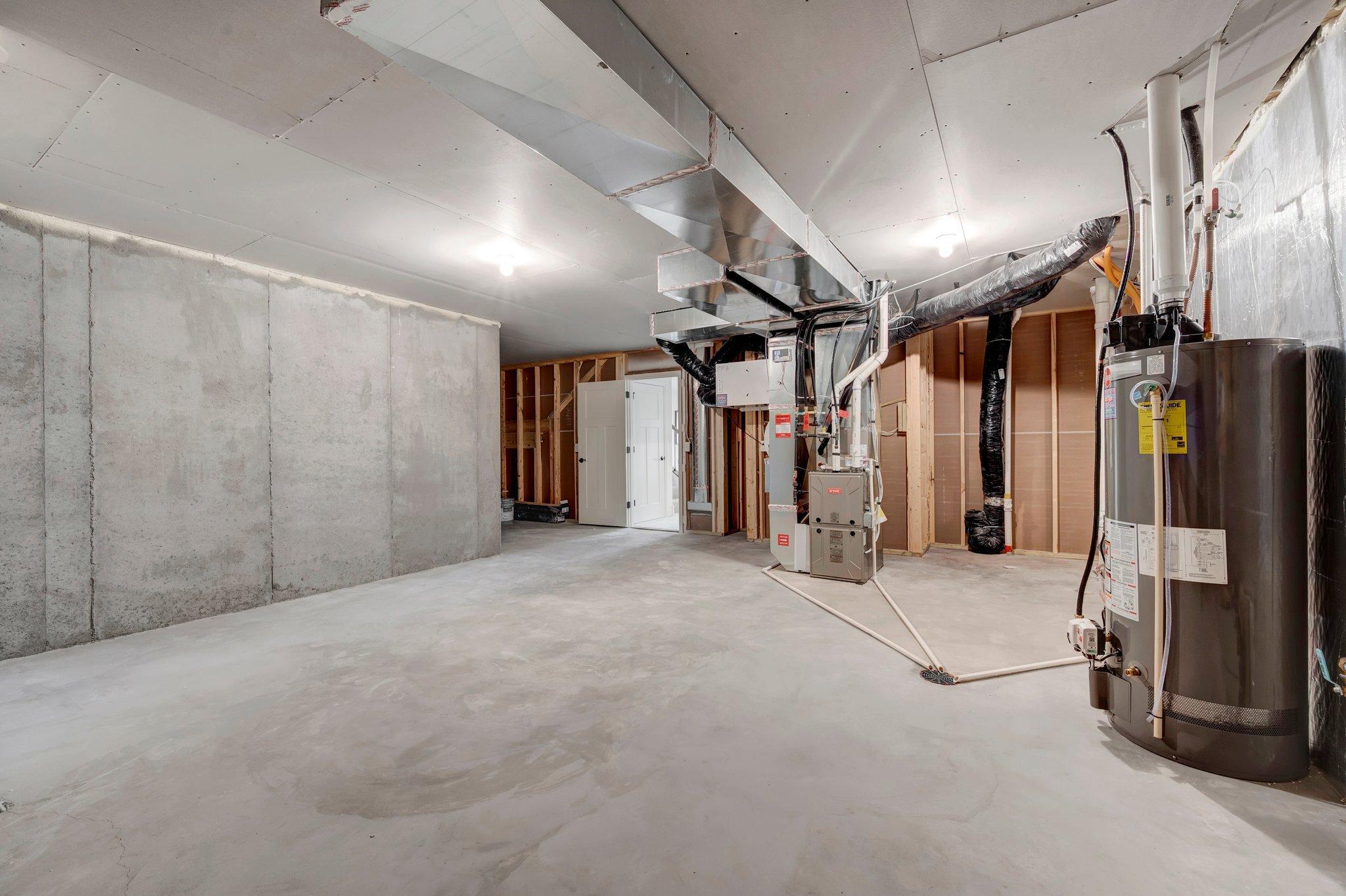 Huge lower level space ready for storage, hobbies, or future plans, giving you room to grow however you need