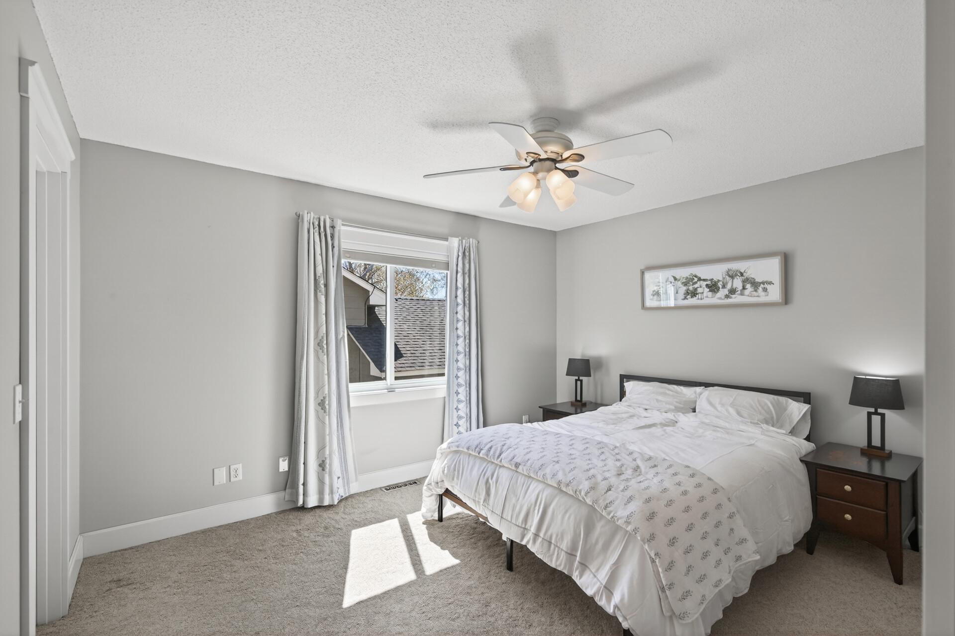 High-end carpeting and custom trim work in the large primary bedroom.