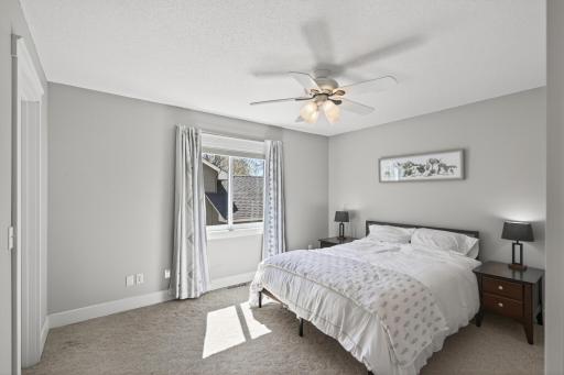 High-end carpeting and custom trim work in the large primary bedroom.