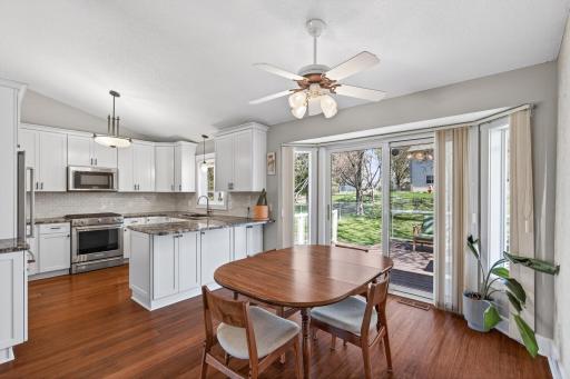 Bright informal dining room with access to the backyard deck.