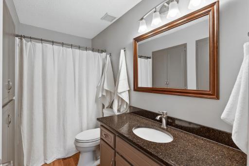 Beautifully updated upstairs bath with custom cabinetry.