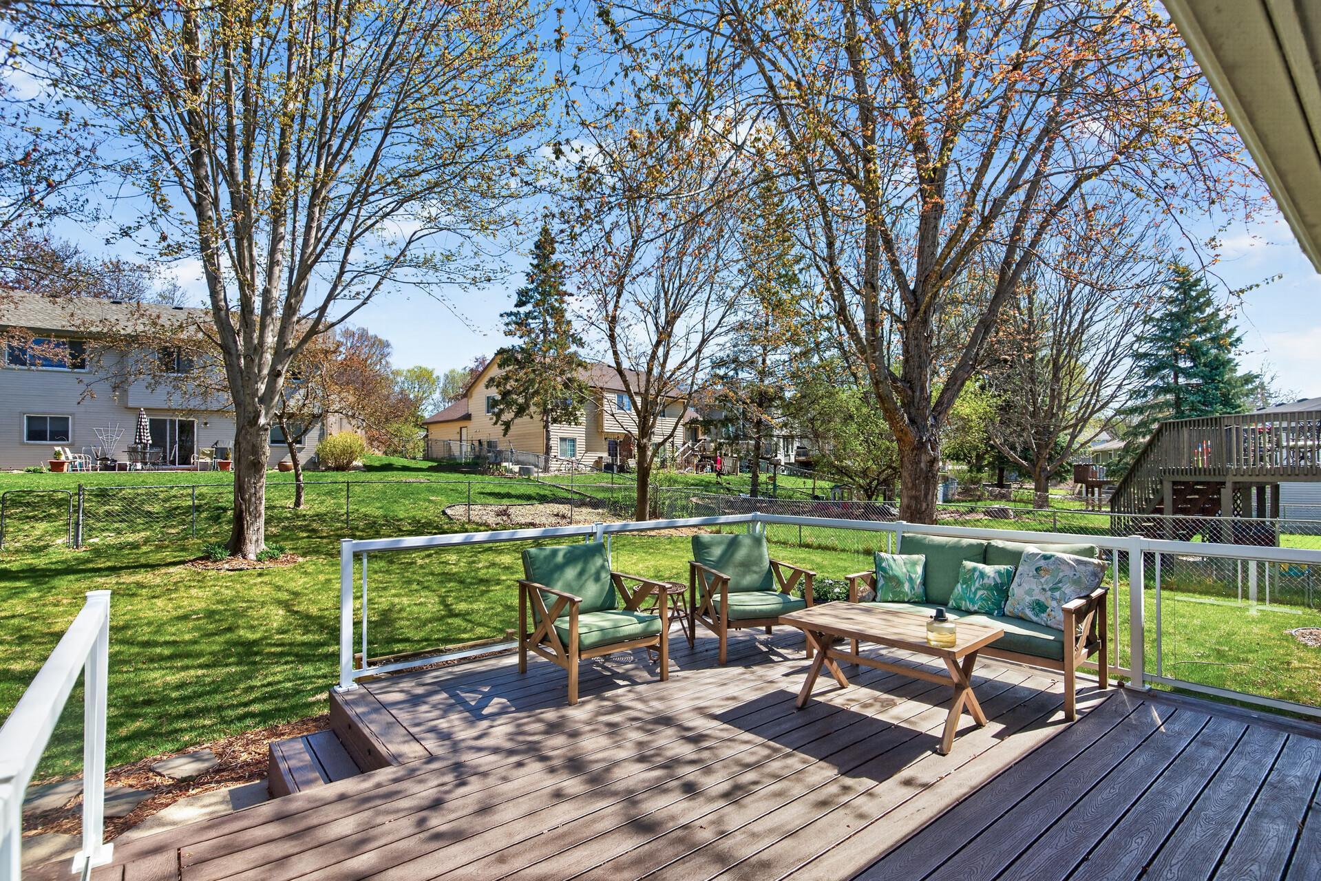 Trex maintenance-free decking with in-deck lighting and glass panel railings.