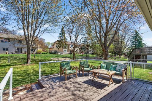 Trex maintenance-free decking with in-deck lighting and glass panel railings.