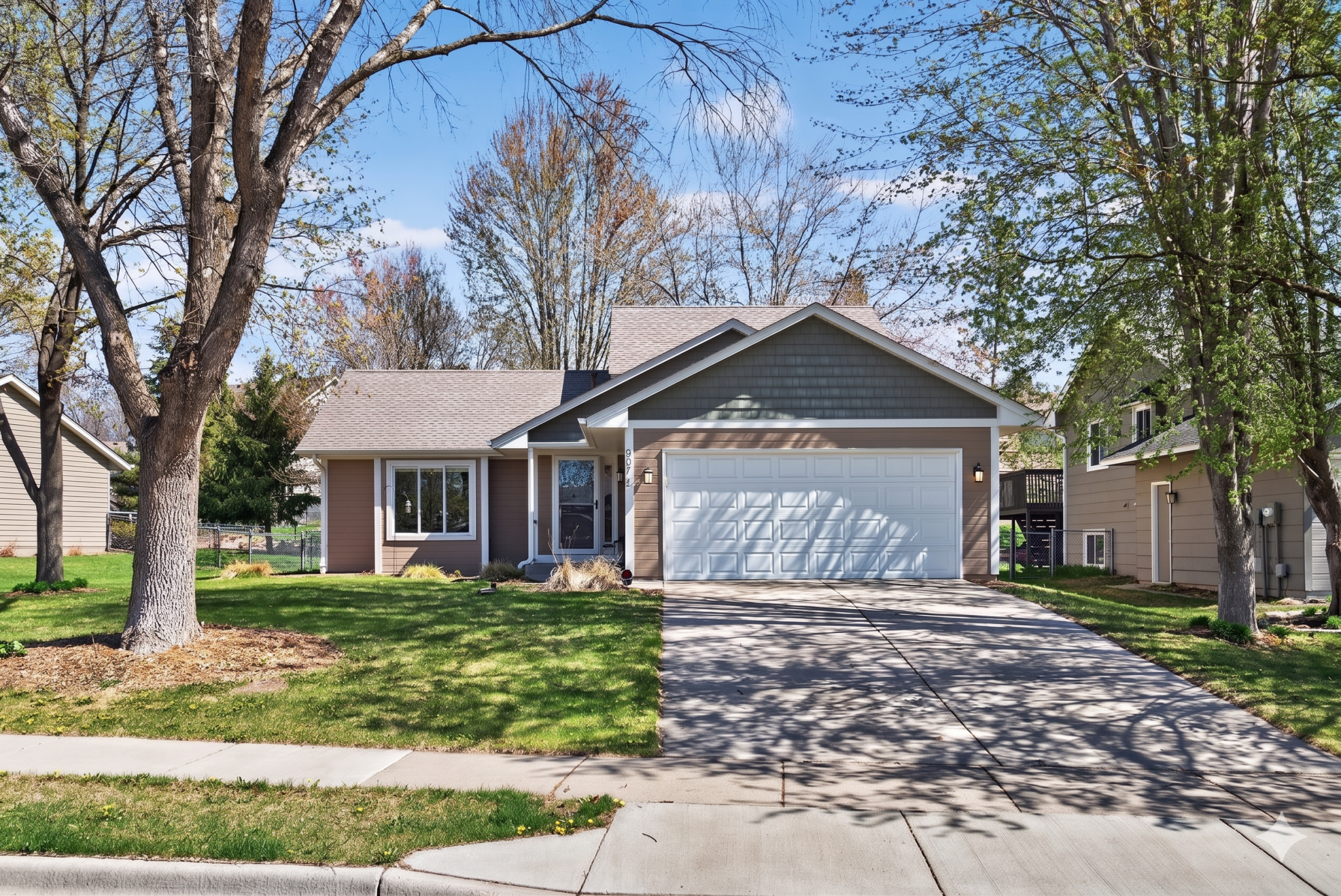 Beautiful maintenance-free exterior with concrete driveway and in-ground irrigation.