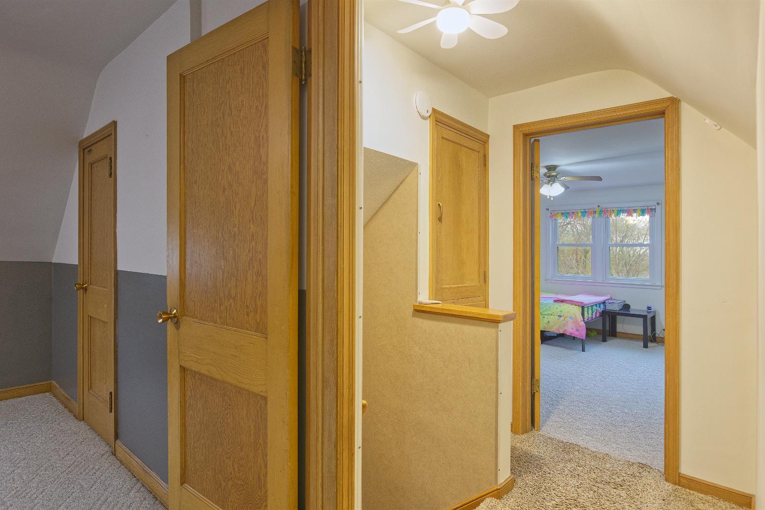 Upper level stairwell and entrance to 2 of the 3 bedrooms